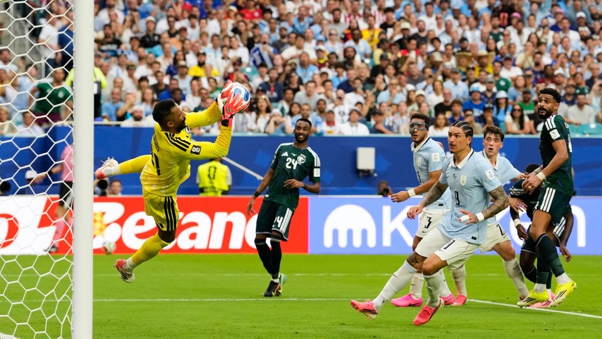 Mohammed Al-Owais catches the ball as Saudi Arabia defend against Uruguay in their 1-1 World Cup Group H draw