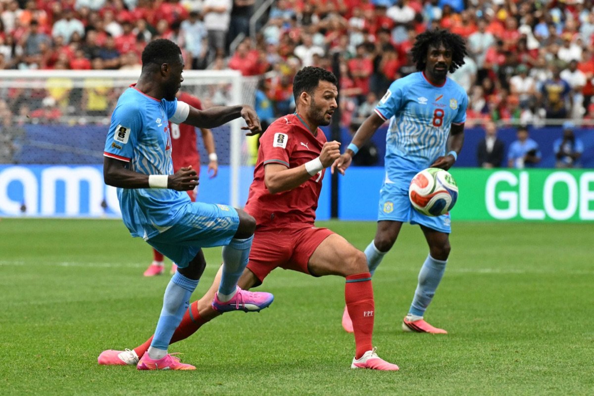 DR Congo players challenge a Portugal midfielder during their 2026 World Cup Group K draw
